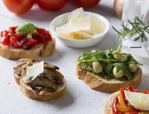 Bruschetta with beans and arugula, mushrooms, goat cheese