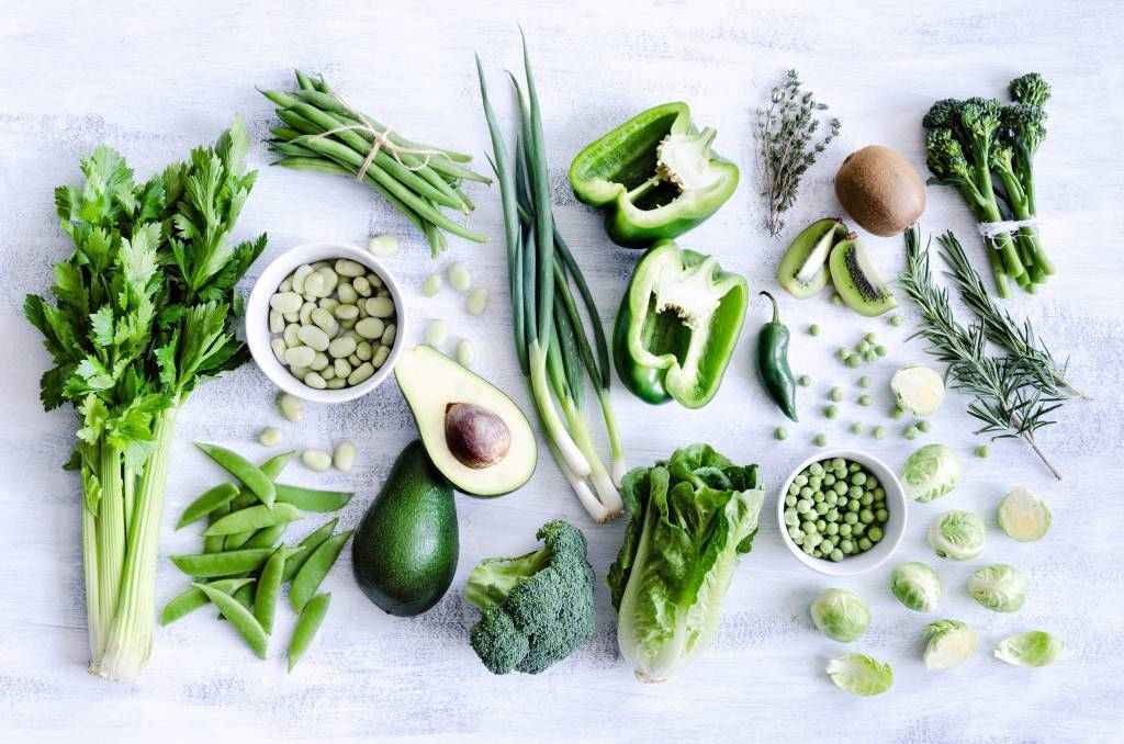 shutterstock_148412789_Fresh green vegetables variety on rustic white background from