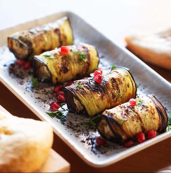 Baked Eggplant Plate Dressed with pomegranate seeds and herbs